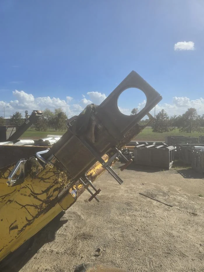 Bucket pin and coupler work on site.